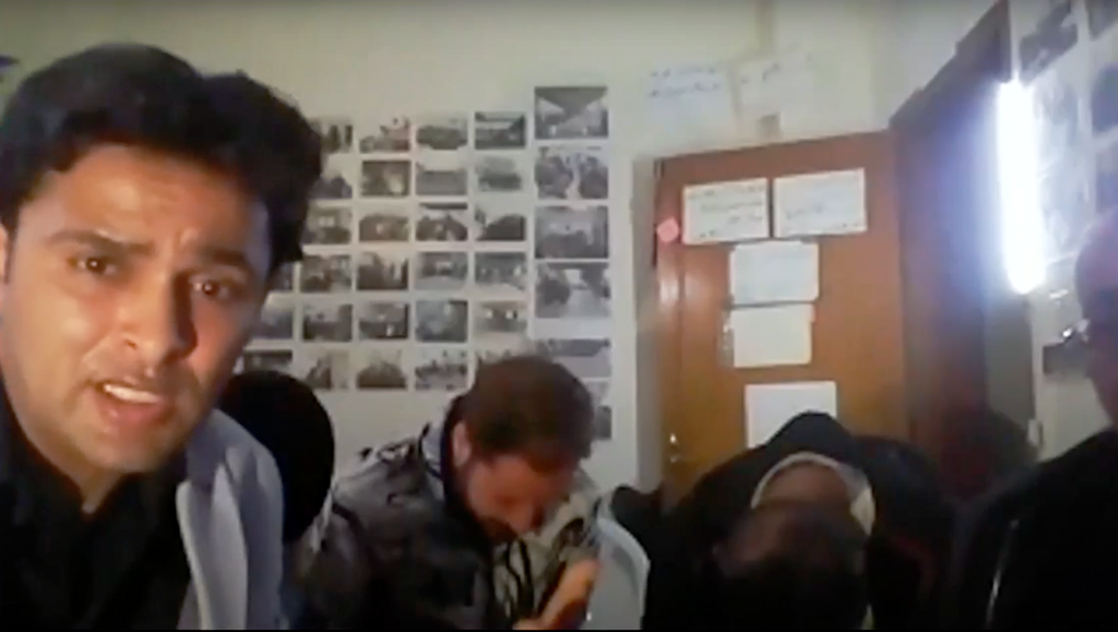 A screengrab from the Zoom video meeting shows Rami Aman, left, one of the organizers of the event, who was later arrested by Hamas 