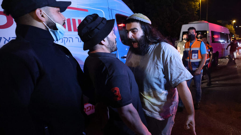 An Israeli settler (R) confronts Palestinian protesters in front of an Israeli settler's house during a demonstration as Palestinian families face eviction, part of an ongoing effort by Jewish Israelis to take control of homes in the Sheikh Jarrah neighbourhood of occupied east Jerusalem (Photo: AFP) An Israeli settler (R) confronts Palestinian protesters in front of an Israeli settler's house during a demonstration as Palestinian families face eviction, part of an ongoing effort by Jewish Israelis to take control of homes in the Sheikh Jarrah neighbourhood of occupied east Jerusalem