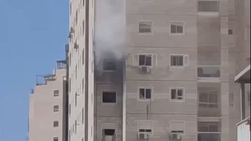 A residential building where one of the victims lived suffers a direct hit A residential building where one of the victims lived suffers a direct hit