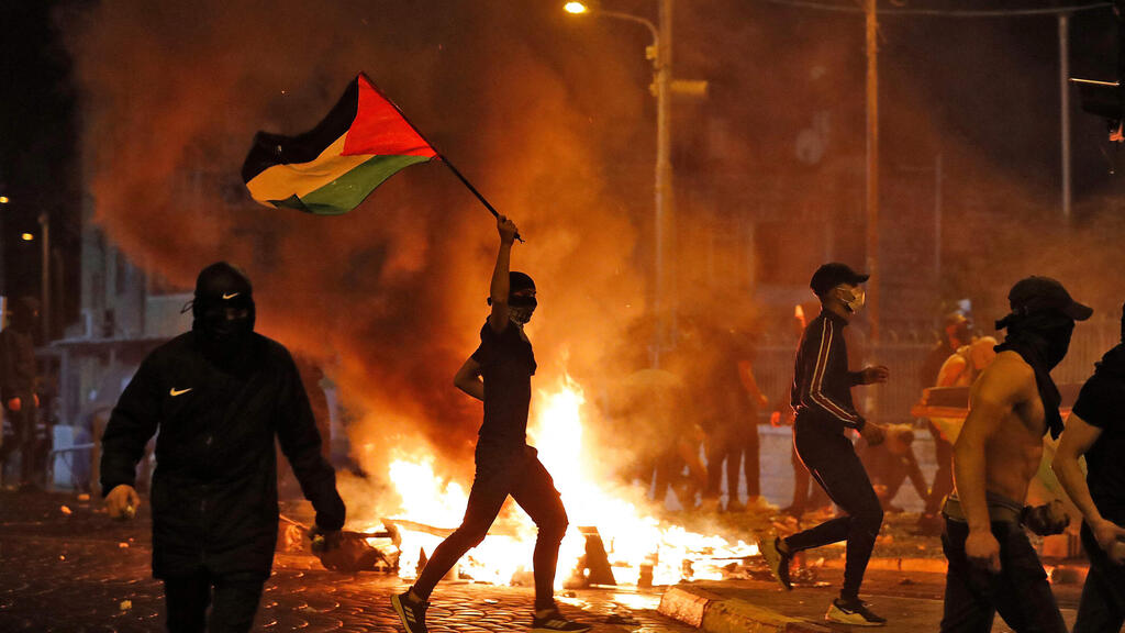 Palestinians riot and clash with police in May in East Jerusalem (Photo: AFP) מהומות במזרח ירושלים
