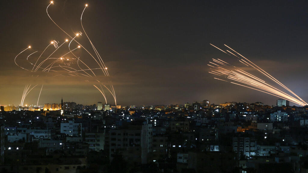 Rockets are fired from the Gaza Strip towards Israel as the Iron Dome launches its missiles to intercept them  
