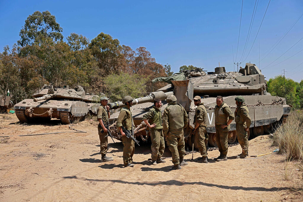 IDF troops stationed on the Gaza border on Friday (Photo: AFP) צה"ל בגבול רצועת עזה