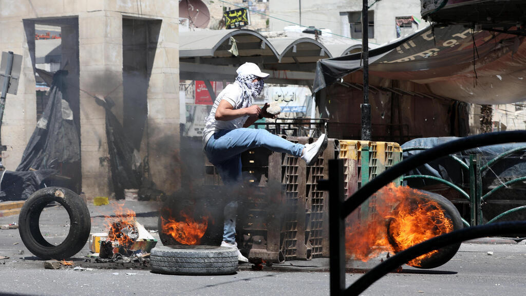 Palestinians demonstrate in the West Bank on Friday 