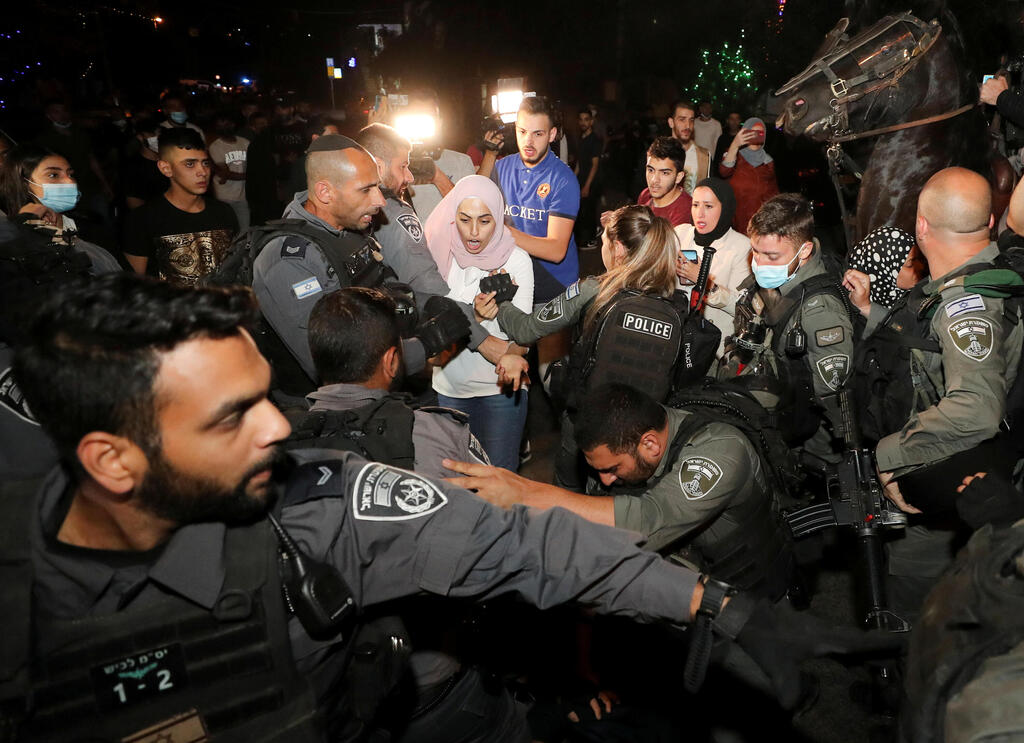 A Palestinian resident reacts during scuffles with Israeli police amid ongoing tension ahead of an upcoming court hearing in an Israeli-Palestinian land-ownership dispute in the Sheikh Jarrah neighborhood of East Jerusalem May 4, 2021