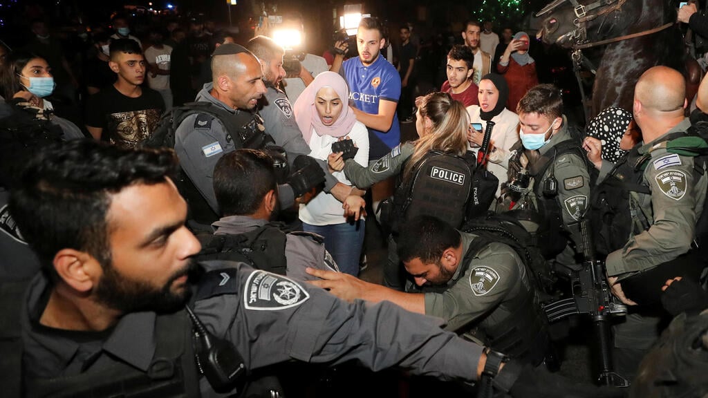 A Palestinian resident reacts during scuffles with Israeli police amid ongoing tension ahead of an upcoming court hearing in an Israeli-Palestinian land-ownership dispute in the Sheikh Jarrah neighborhood of East Jerusalem May 4, 2021 (Photo: Reuters) A Palestinian resident reacts during scuffles with Israeli police amid ongoing tension ahead of an upcoming court hearing in an Israeli-Palestinian land-ownership dispute in the Sheikh Jarrah neighborhood of East Jerusalem May 4, 2021
