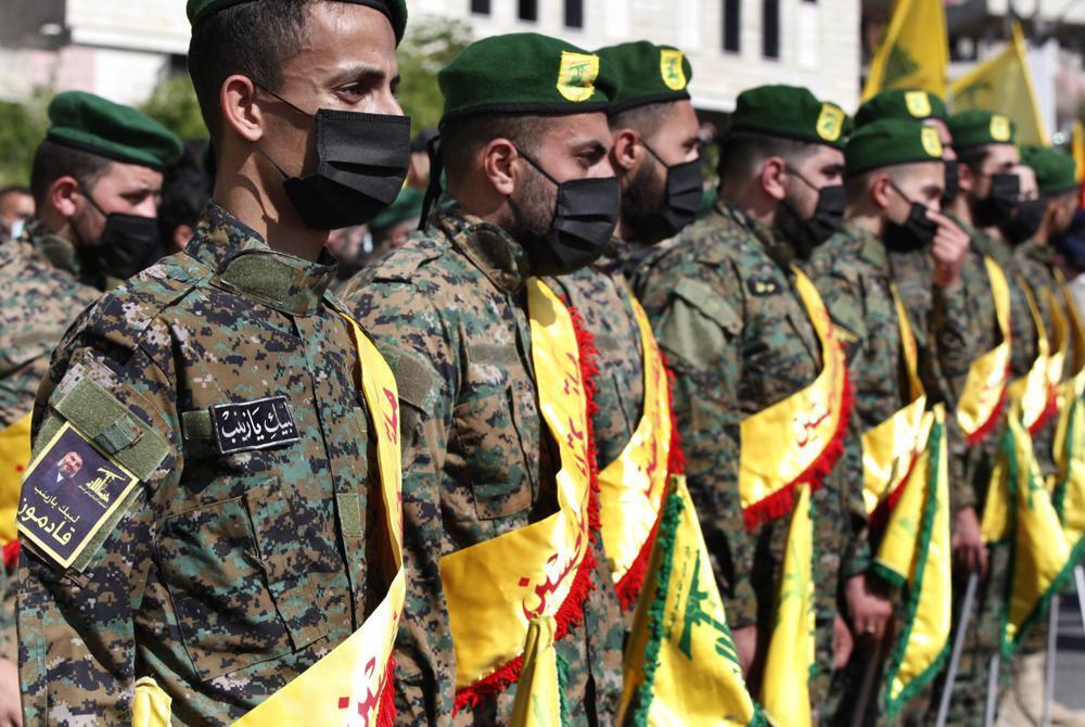 Hezbollah fighters attend the funeral procession of their comrade Mohammed Tahhan who was shot dead on Friday by Israeli forces along the Lebanon-Israel border, in the southern village of Adloun, Lebanon 