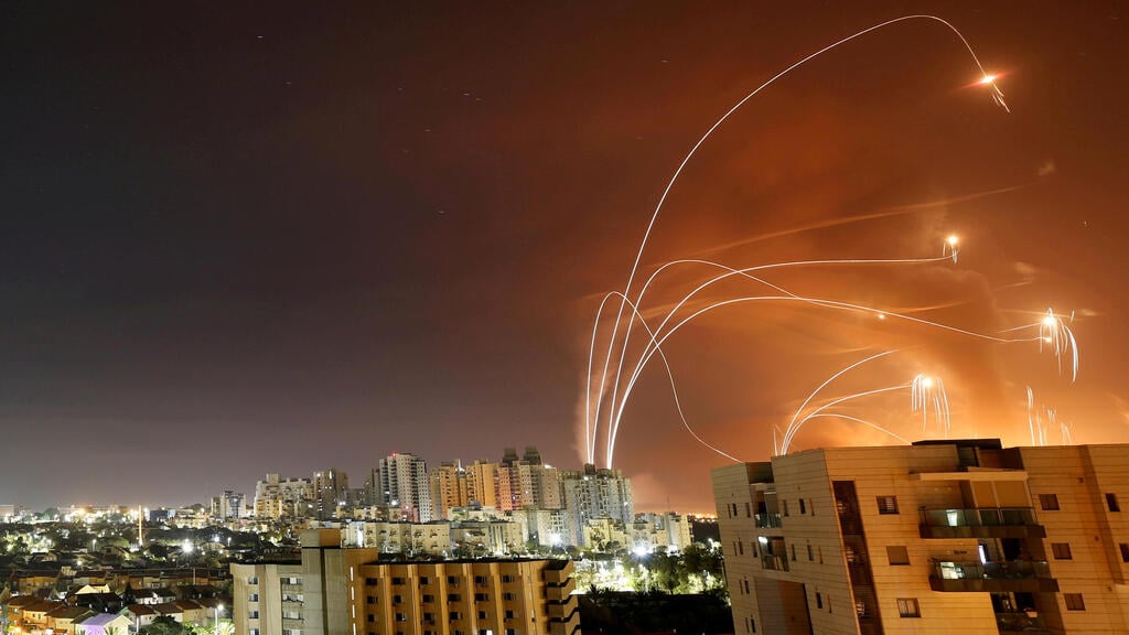 Streaks of light are seen as Israel's Iron Dome anti-missile system intercept rockets launched from the Gaza Strip towards Israel (Photo: Reuters) Streaks of light are seen as Israel's Iron Dome anti-missile system intercept rockets launched from the Gaza Strip towards Israel, as seen from Ashkelon,
