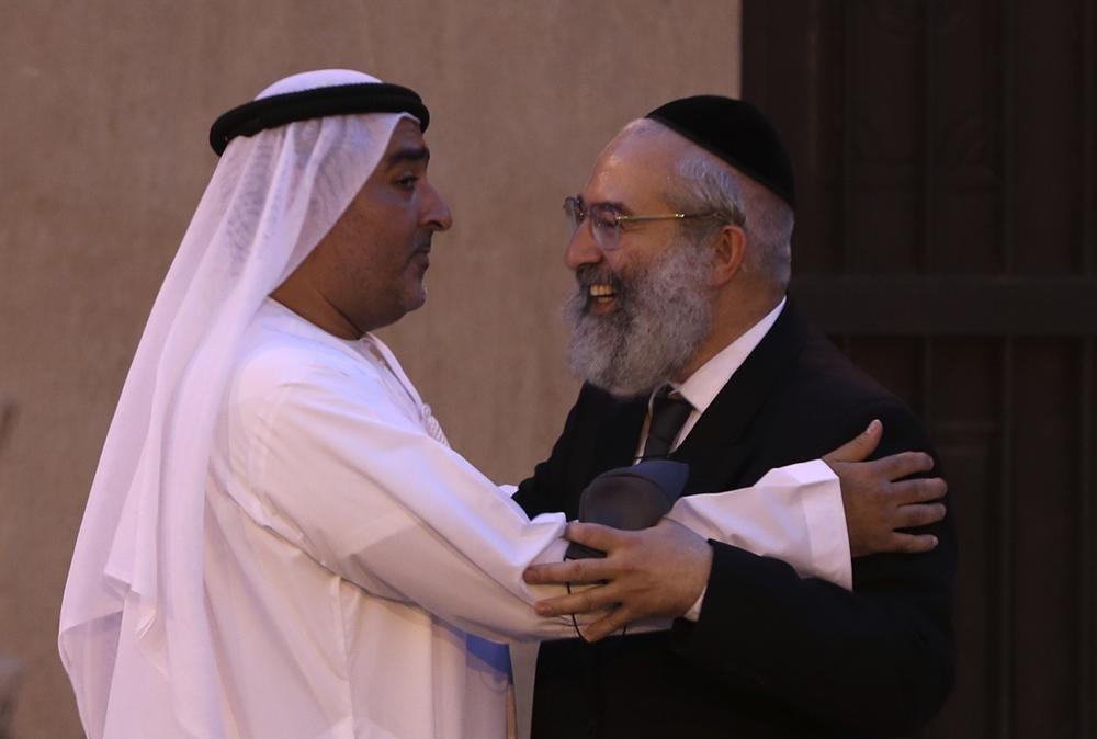 Ahmed Al Mansuri, founder of Crossroads of Civilization private museum, left, greets a rabbi at an exhibition commemorating the Jewish Holocaust in Dubai, United Arab Emirates 