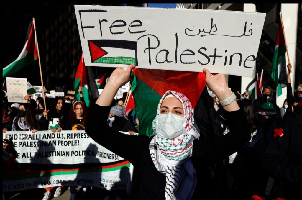 Protesters march through the streets of Chicago's Loop in support of Palestinians, May 12, 2021.