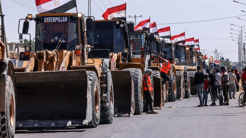 A convoy of Egyptian bulldozers arrives on the Gaza side of the Rafah border crossing between Egypt and the Strip, June 4, 2021 