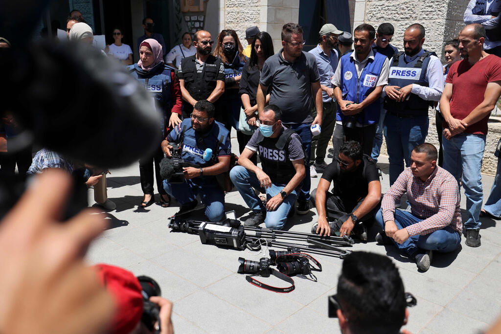 Journalists protest outside the United Nations office in the occupied West Bank city of Ramallah on June 28, 2021, demanding protection following attacks by Palestinian security forces on their colleagues 