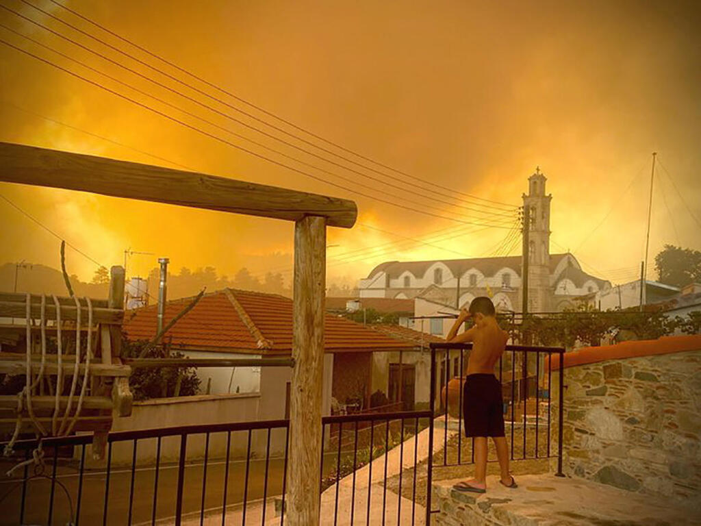 Smoke from a forest fire is seen in Ora village in Larnaca, in an image obtained from social media, July 3, 2021 