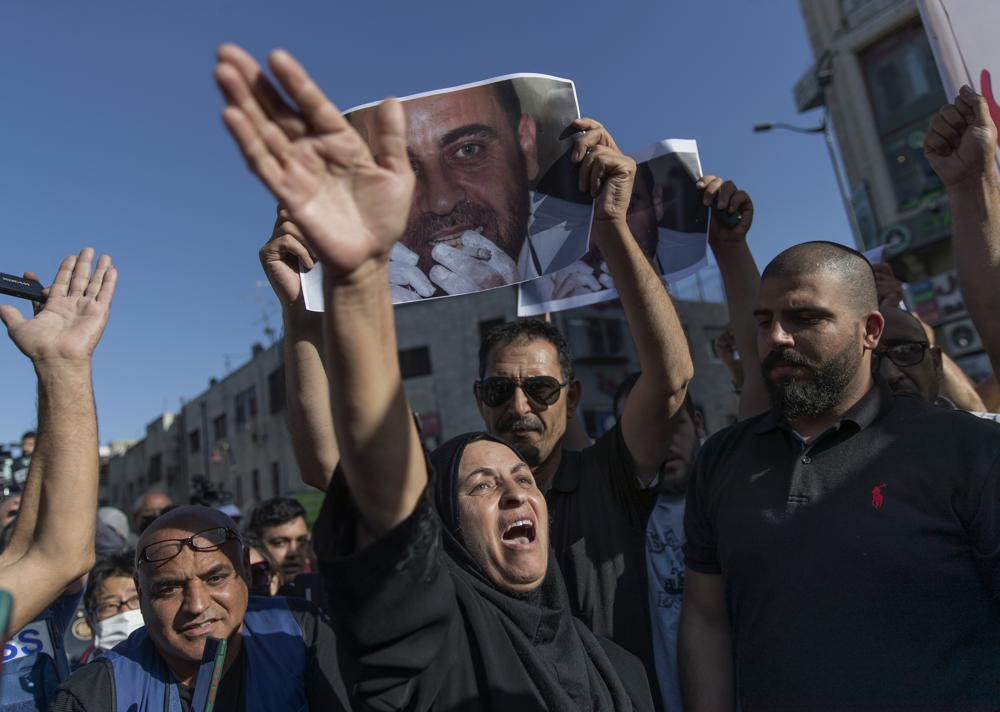 Maryam Banat, 67, mother of Palestinian Authority outspoken critic Nizar Banat chant ant Palestinian Authority slogans during a rally protesting his death, in the West Bank city of Ramallah 