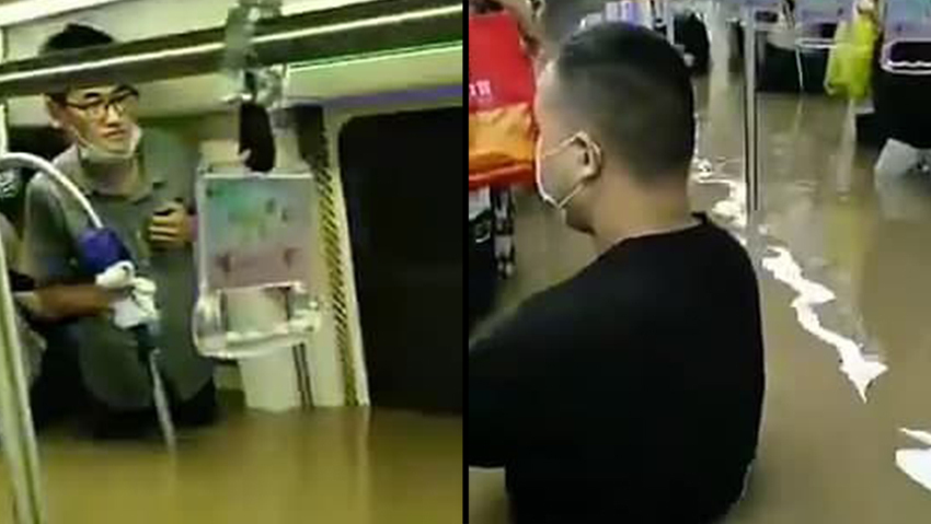 מחכים למחלצים בעוד מפלס המים עולה, בקרונות הרכבת בז'נגז'ו סין שיטפונות ז'נגז'ו