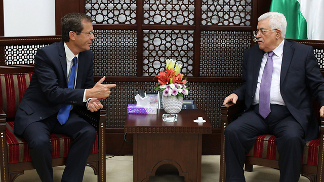Then-opposition leader Isaac Herzog meeting with Palestinian President Mahmoud Abbas in Ramallah in 2015 