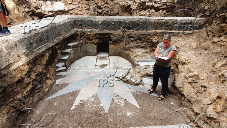 An Israeli archeologist at site of  the Torah Ark from a synagogue destroyed during the Holocaust 