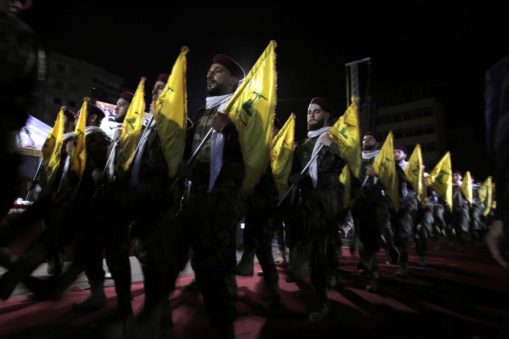 Hezbollah fighters march at a rally (Photo: AP) 2019 file photo, Hezbollah fighters march at a rally to mark Jerusalem day, in the southern Beirut suburb of Dahiyeh, Lebanon