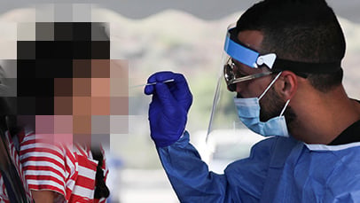 A child is tested for COVID in Tel Aviv in August (Photo: EPA) היום הראשון ללימודים בבית ספר ארזים בתל אביב
