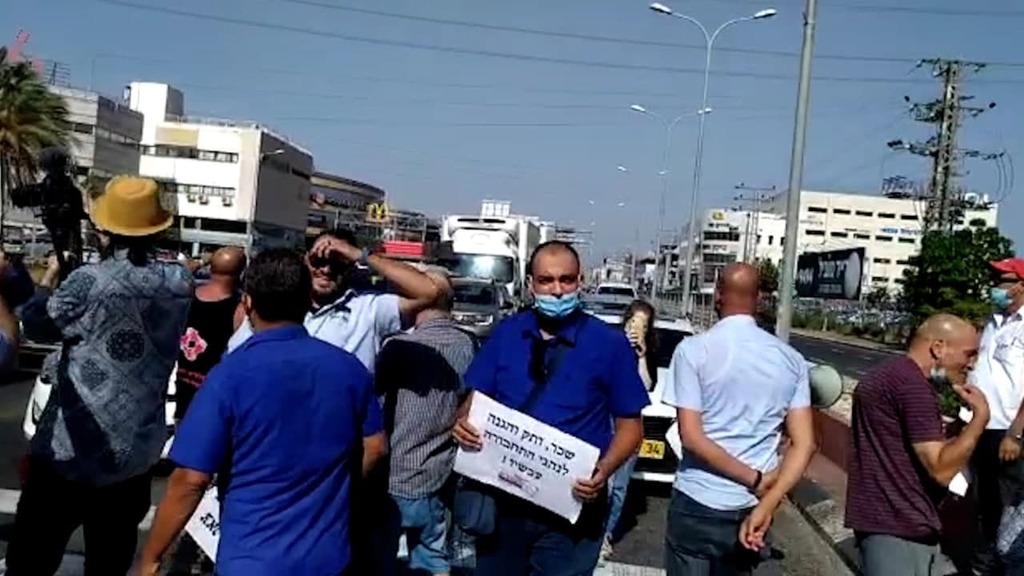 מחאת נהגי האוטובוסים בחיפה (צילום: כח לעובדים) מחאת נהגי האוטובוסים במרכזית המפרץ חיפה