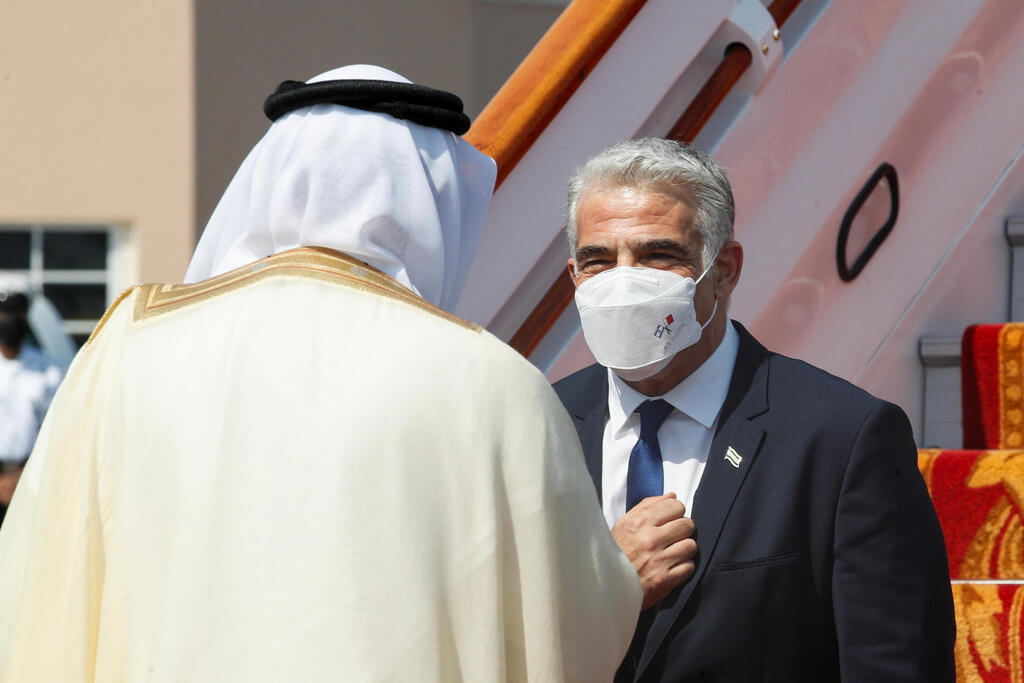 Foreign Minister Yair Lapid greeted by his Bahraini counterpart Abdullatif bin Rashid Al Zayani upon landing in Manama on Thursday (Photo: Reuters) יאיר לפיד נוחת בבחריין