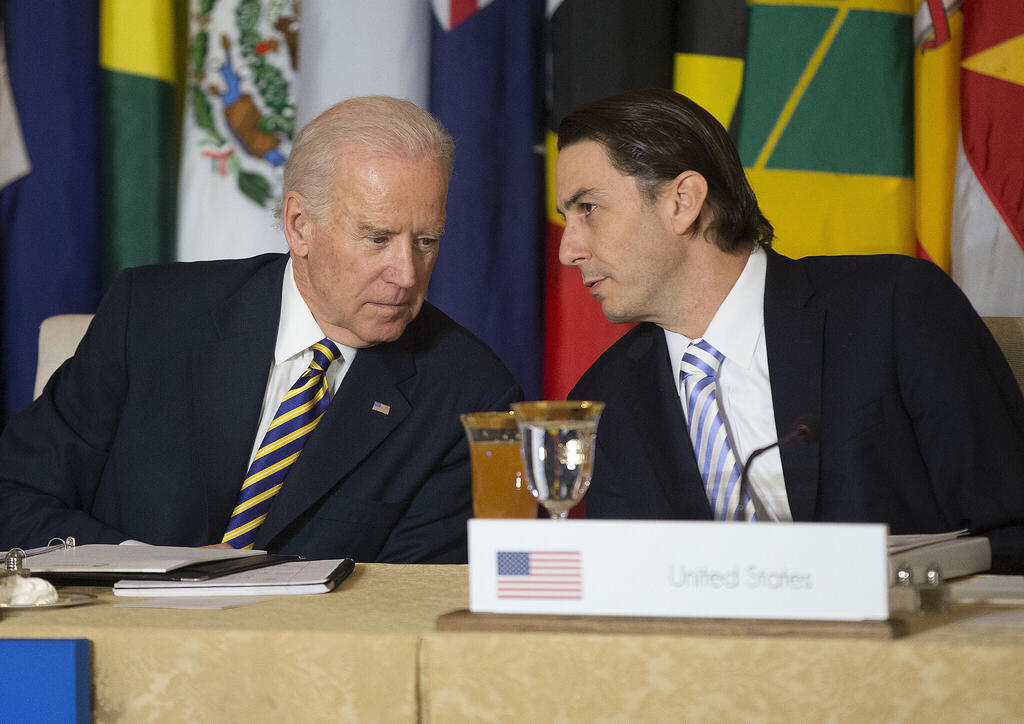 Then-US Vice President Joe Biden, left, talks with State Department Special Envoy for International Energy Affairs Amos Hochstein during the Caribbean Energy Security Summit in 2015 