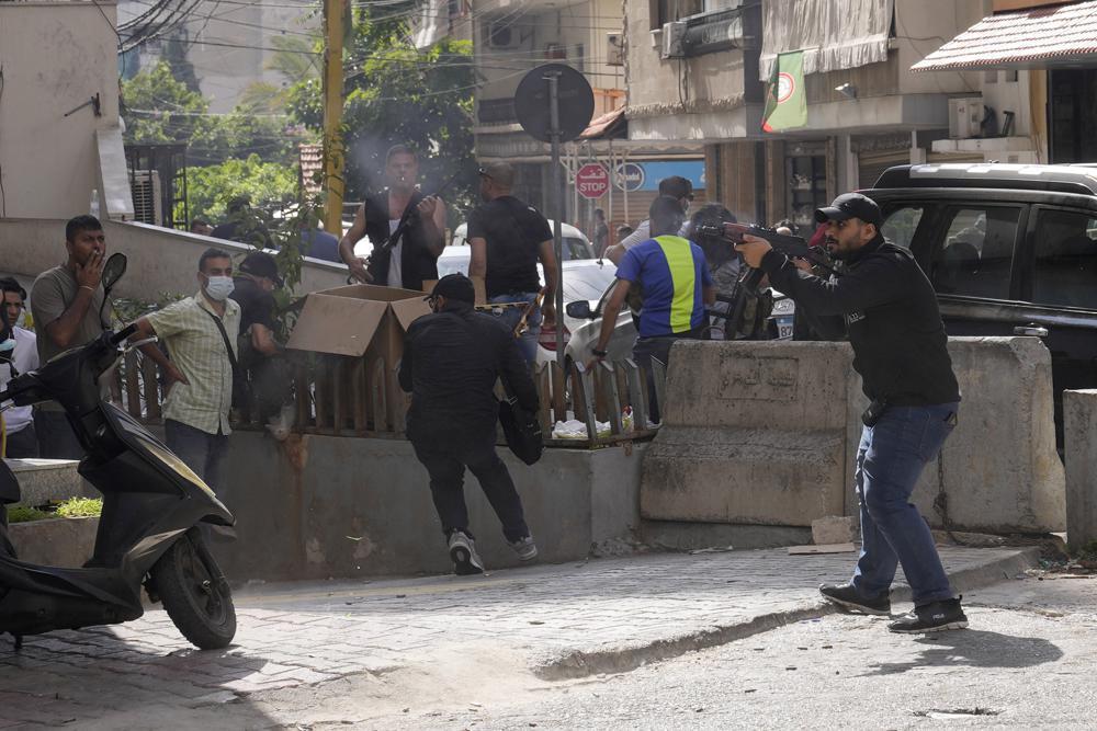 Supporters of a Shi'ite group allied with Hezbollah fire weapons during armed clashes that erupted during a protest in the southern Beirut suburb of Dahiyeh, Lebanon (Photo: AP) Supporters of a Shiite group allied with Hezbollah fire weapons during armed clashes that erupted during a protest in the southern Beirut suburb of Dahiyeh, Lebanon