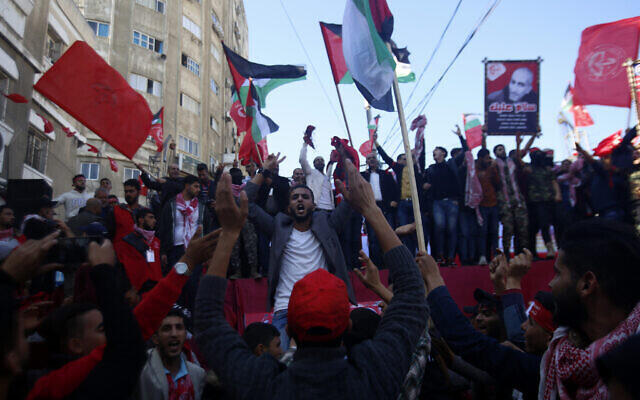 Palestinians participate in a rally marking the 52nd anniversary of the Popular Front for the Liberation of Palestine (PFLP), in Gaza City 