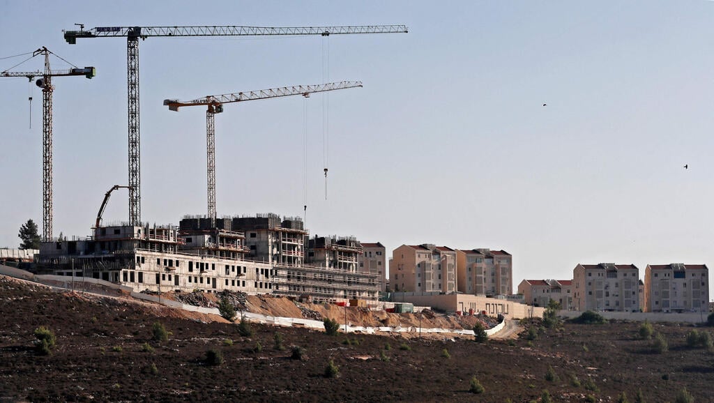 construction work in the Jewish settlement of Givat Zeev, near the Israeli-occupied West Bank city of Ramallah 