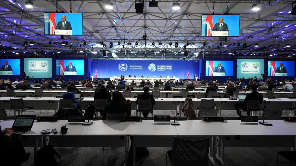 President of the United Nations General Assembly Abdulla Shahid is seen on screen as he speaks at the start of UN Climate Change Conference (COP26) in Glasgow
