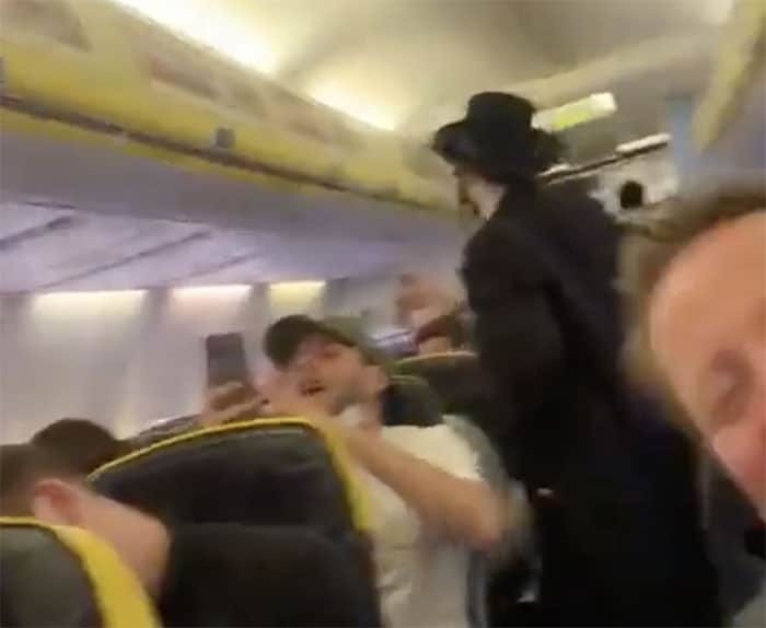 Ultra-Orthodox Jewish man seen on a Ryanair flight from London to Brussels as he was subjected to anti-Semitic chants by soccer fans