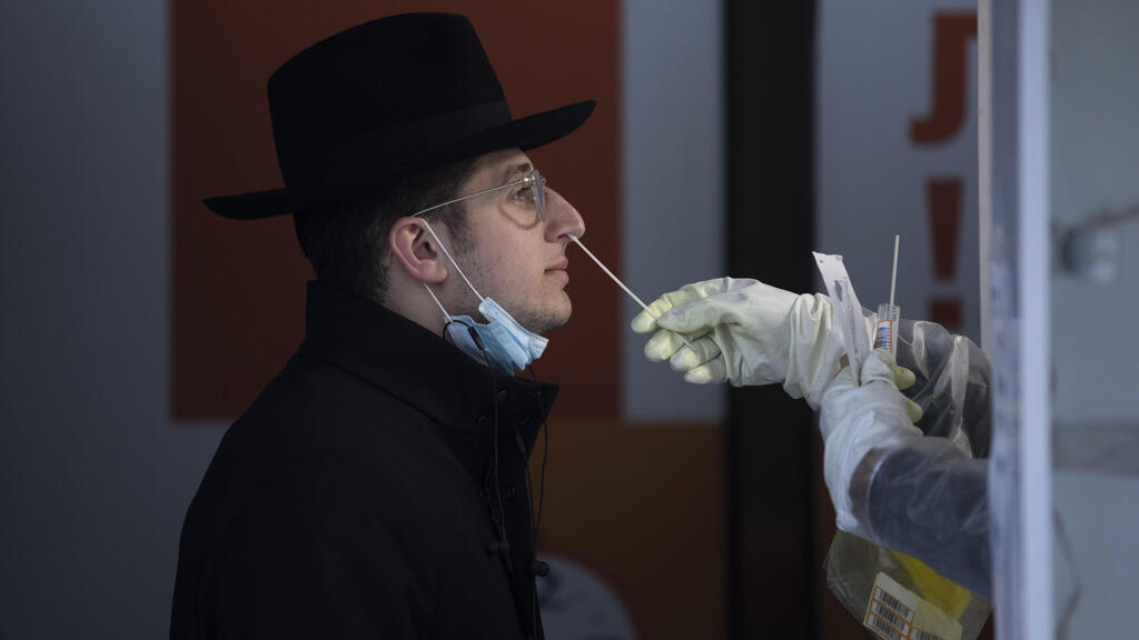 A Haredi man is tested for COVID-19 in Jerusalem 