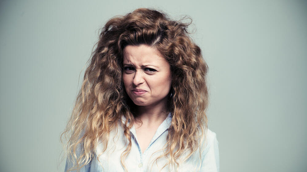 "התחלתי לסלוד מהריח של בן זוגי" (צילום: Shutterstock) אישה מעוותת את פרצופה