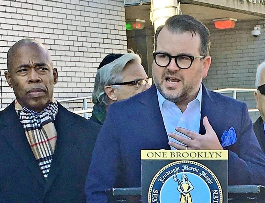 Community Security Service CEO Evan Bernstein (R), alongside then-Brooklyn Borough President Eric Adams, now the mayor of New York (L), after a hate crime in Brooklyn in 2019 