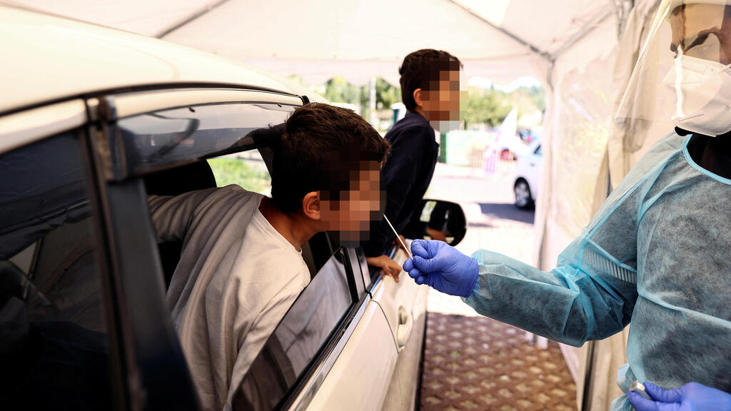 A child is tested for COVID in Jerusalem (Photo: Reuters) בדיקות קורונה בירושלים