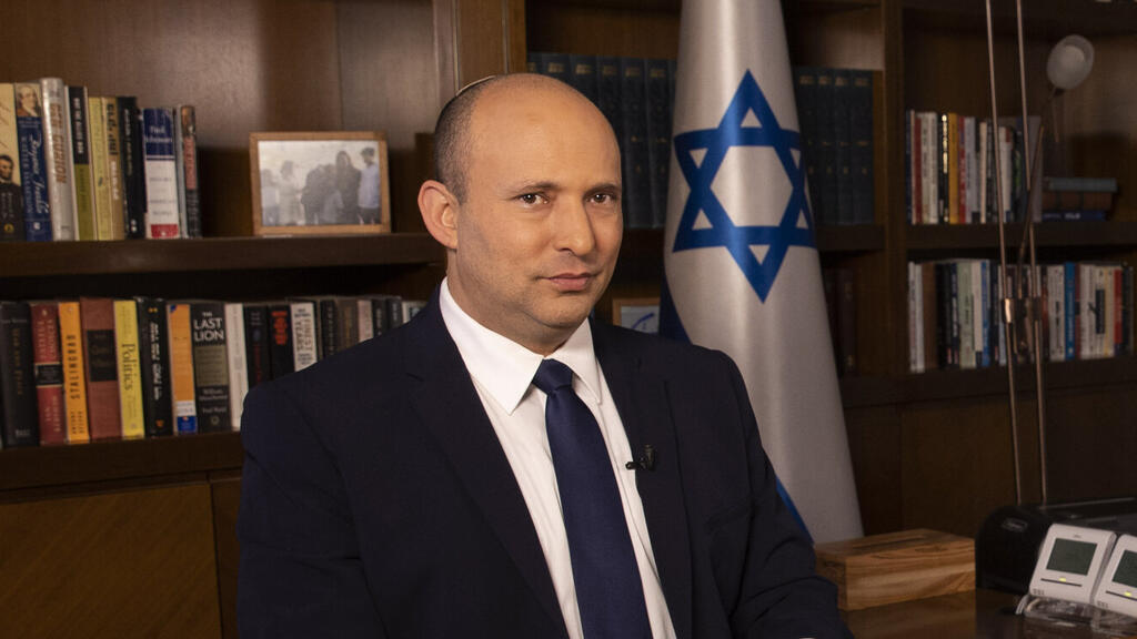 Prime Minister Naftali Bennett in his office in Jerusalem
