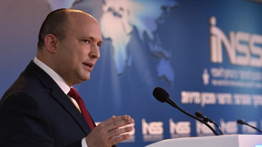 Prime Minister Naftali Bennett speaking at the 15th annual conference of the Institute for National Security Studies (Photo: GPO) נפתלי בנט בכנס השנתי של INSS
