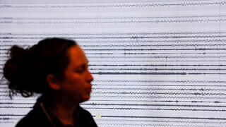 Seismic waves are seen on a screen during a demonstration of a new earthquake early warning system which triggers sirens if a nationwide network of 120 seismic monitoring stations detects a strong earthquake, at the Geological Survey of Israel in Jerusalem, February 7, 2022