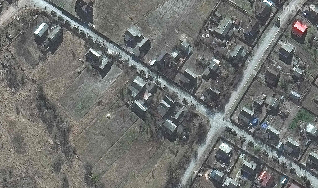 צילום: AFP /Satellite image ©2022 Maxar Technologies תמונות לוויין שמראות שיירה של מאות כלי רכב של צבא רוסיה כולל טנקים שעושה את הדרך לכיוון קייב אוקראינה במרחק של כ-50 ק"מ