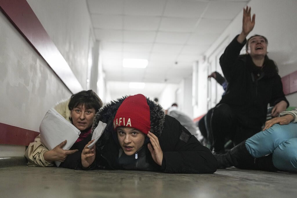 People lay on the floor to protect against Russian shelling in Mariupol hospital 