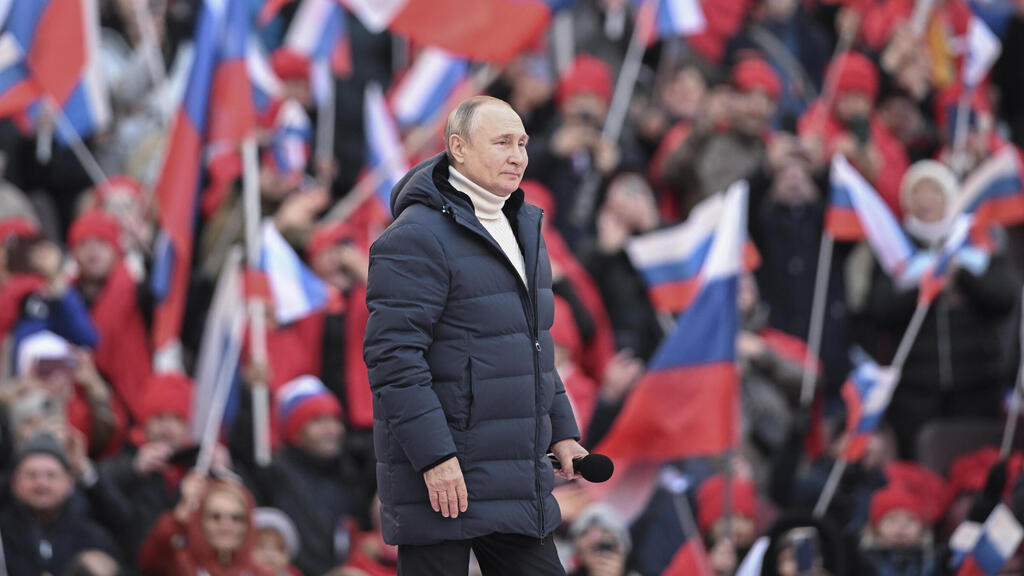 Russian President Vladimir Putin holds a rally in Moscow on Friday 