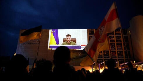 Israelis watch Zelensky address carried live in Tel Aviv city square on Sunday (Photo: Reuters) Israelis watch Zelensky address carried live in Tel Aviv city square on Sunday