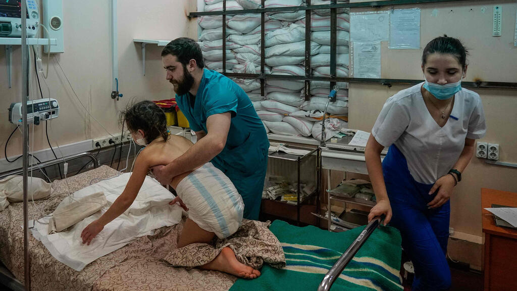 A 13-year old child receives treatment after being shot while fleeing Mariupol (Photo: AFP) A 13-year old child receives treatment after being shot while fleeing Mariupol