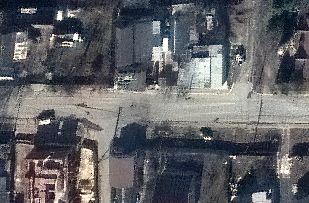 This handout satellite image released by Maxar Technologies on April 4, 2022 shows a view of Yablonska Street in Bucha, Ukraine, on March 19, 2022. Satellite photographs released on April 4, 2022 appear to rebut Russian assertions that dead bodies in civilian clothing found in Bucha 