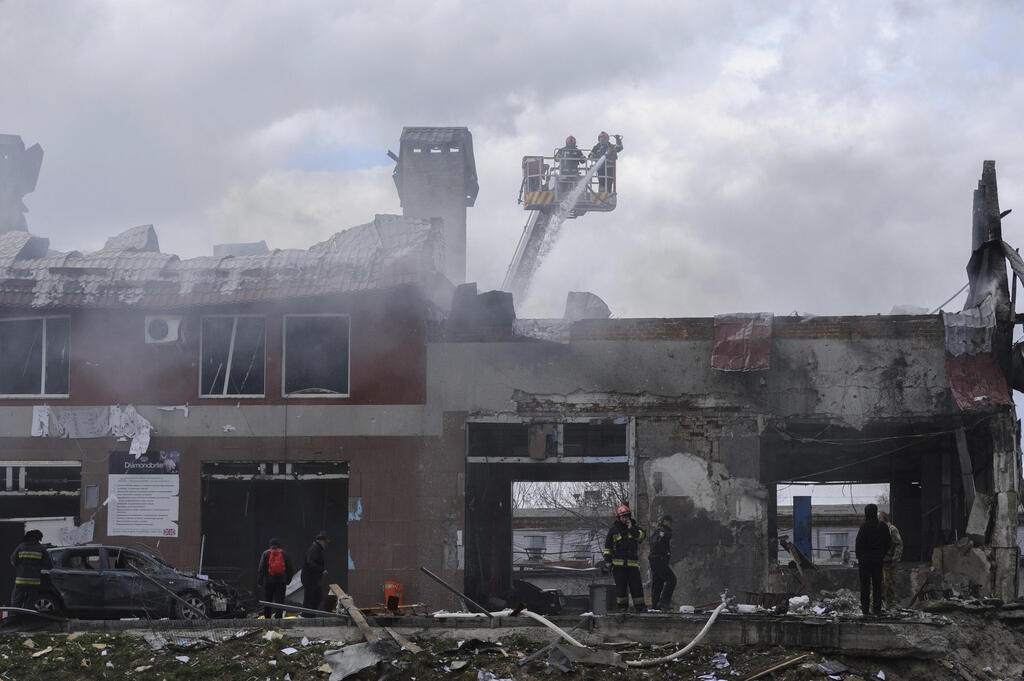 Aftermath of an airstrike that hit a tire shop in Lviv on Monday (Photo: AP) Aftermath of an airstrike that hit a tire shop in Lviv on Monday
