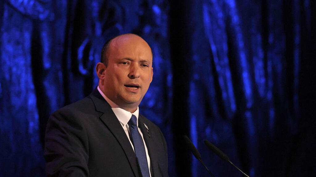 ראש הממשלה בנט בנאומו ביד ושם (צילום: AFP) טקס יום הזיכרון לשואה ביד ושם