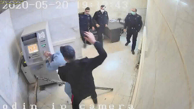 A frame grab taken from video shows a guard beating a prisoner at Evin prison in Tehran, Iran