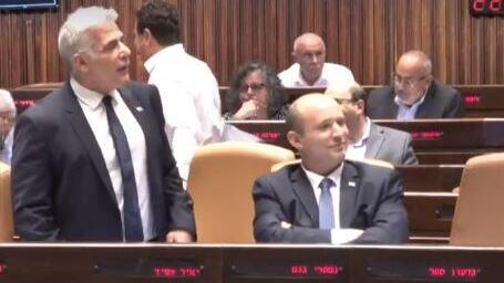 Yair Lapid and Naftali Bennett in the Knesset (Photo: Screenshot) Yair Lapid and Naftali Bennett in the Knesset on Monday