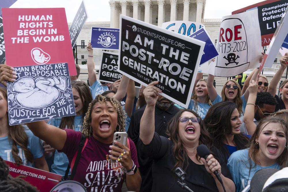 Demonstrators gather outside the Supreme Court in Washington, Friday, June 24, 2022. The Supreme Court has ended constitutional protections for abortion that had been in place nearly 50 years 