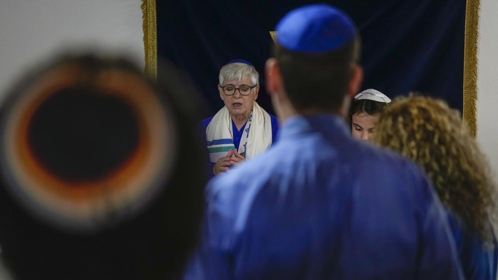Rabbi Barbara Aiello, left, celebrates the Bat Mitvah ceremony of Mia 