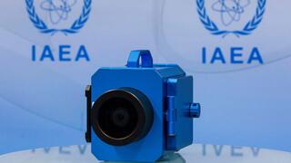 A surveillance camera is displayed during a news conference about developments related to the IAEA's monitoring and verification work in Iran 